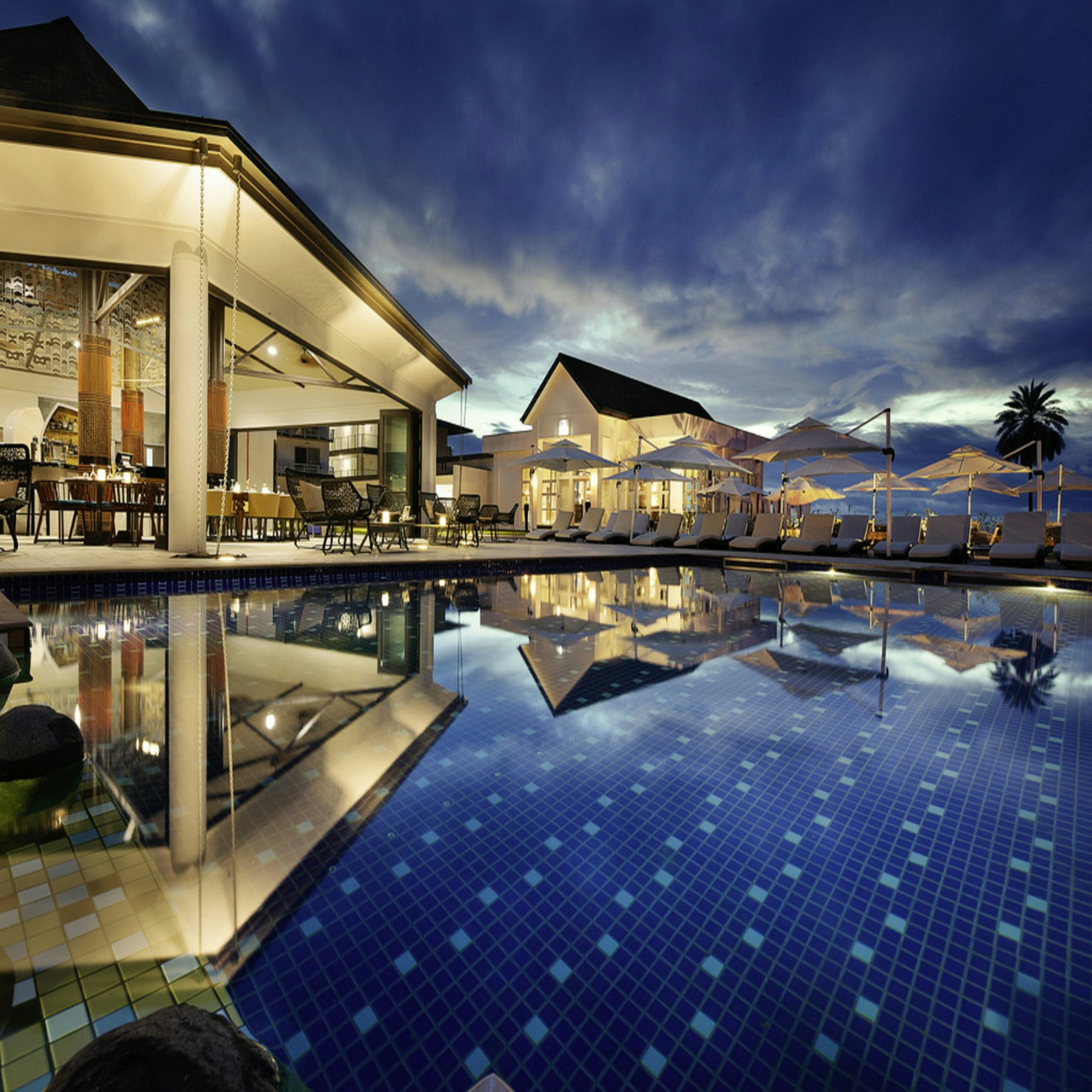 Illustrative resort with a landscaped pool